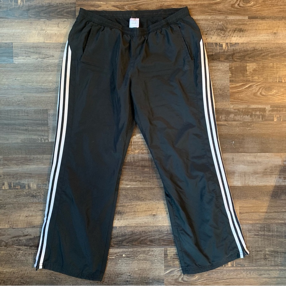 Adidas track pants.